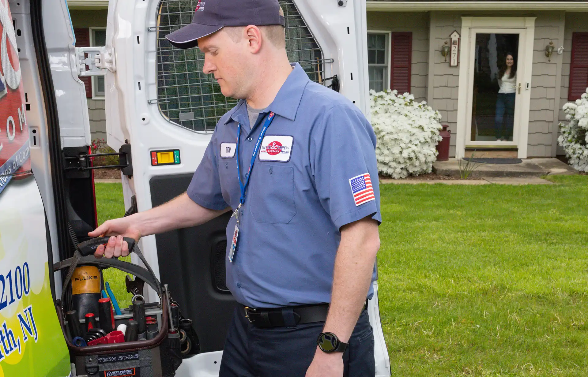 Tom getting heating repair tools out of the Meyer & Depew HVAC repair van