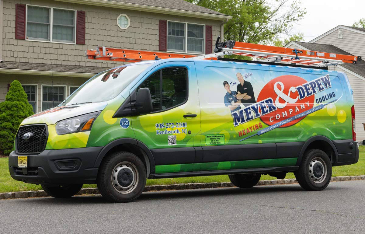 The Meyer and Depew work van outside of a home.