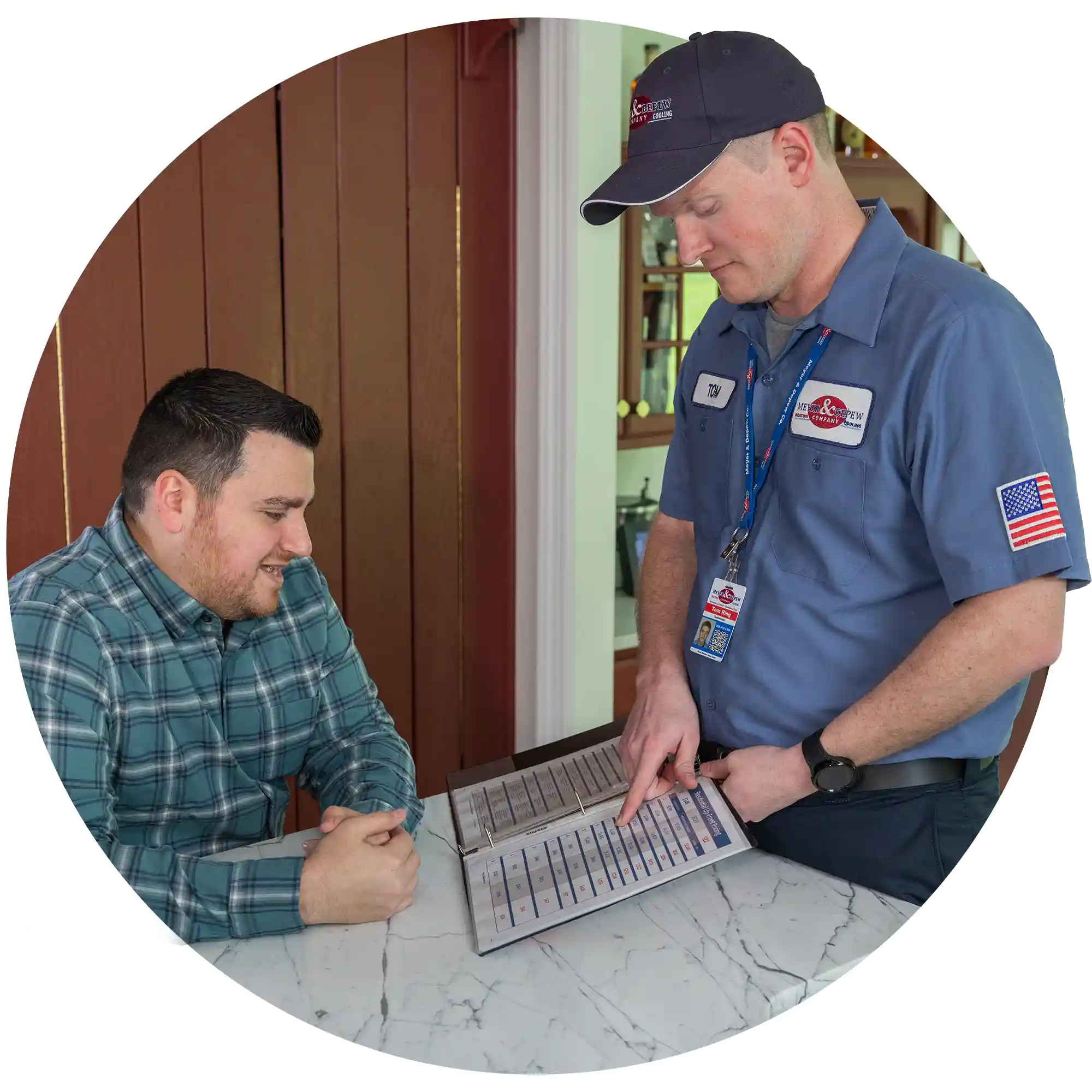 technician shaking hands with an HVAC client